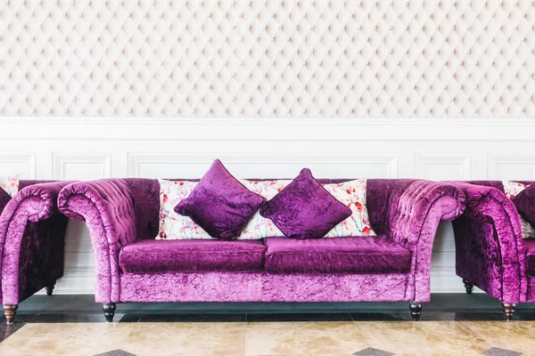 Purple sofas with pillows