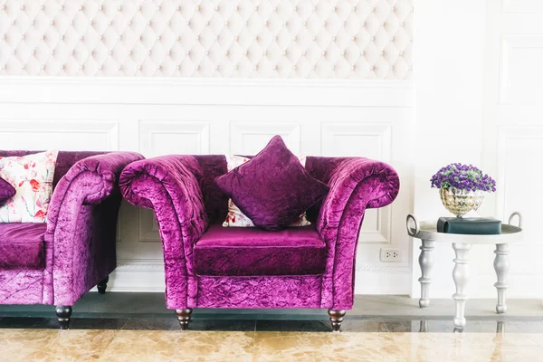 Purple sofas with pillows