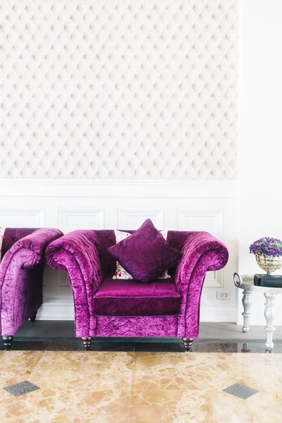 Purple sofas with pillows