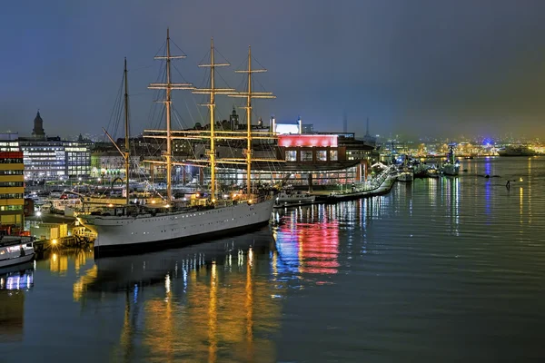 Harbor of Gothenburg with the ship Barken Viking and Opera house in the foggy evening, Sweden