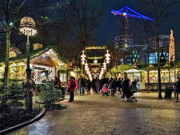 Christmas market in Tivoli Gardens of Copenhagen in evening, Denmark
