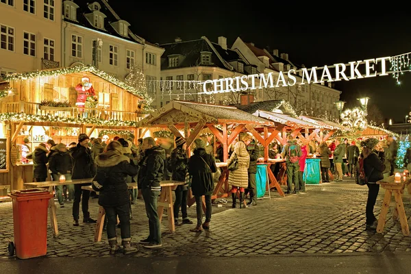 Christmas market on the Hojbro Plads square of Copenhagen in evening