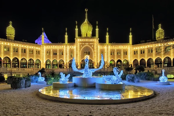 Moorish Palace and Christmas installation with Swans in Tivoli Gardens in the night, Denmark