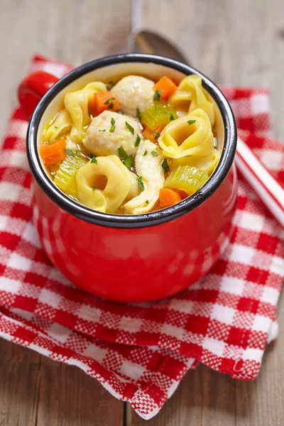 Warm chicken meatball tortellini soup