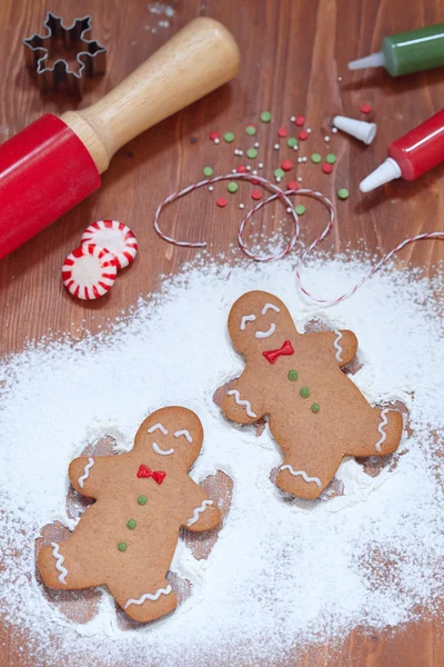 Gingerbread man making a snow angel