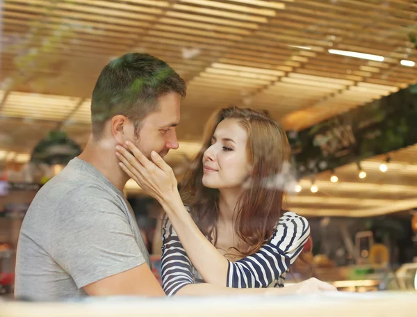 Couple sitting indoors in cafe
