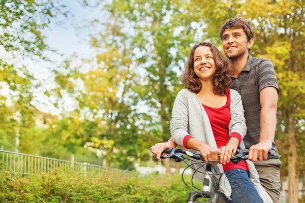 Couple riding together  bicycle