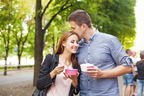 Couple eating dessert together