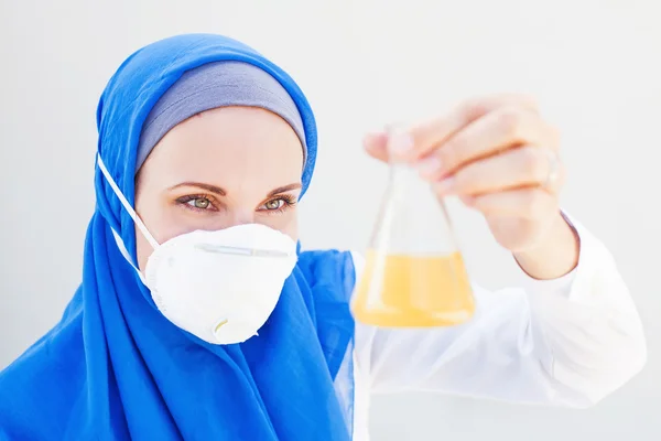 Muslim lab worker doing an analysis