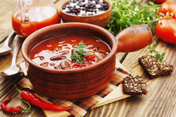 Chili soup with red beans and greens