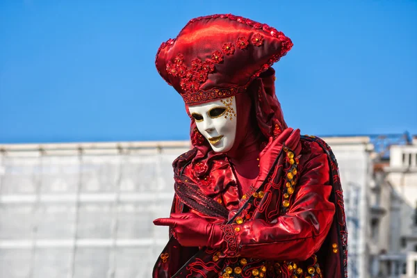 Red Carnival mask in St Mark\'s square, Venice, Italy