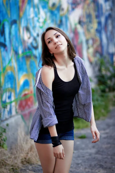 Young girl on graffiti background