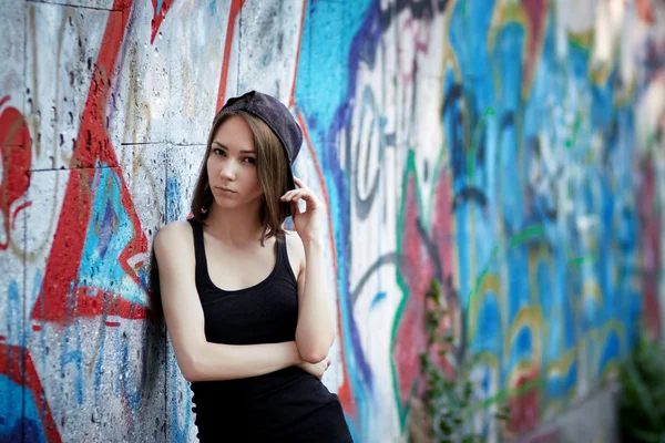 Young girl on graffiti background
