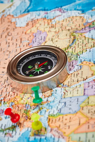 The magnetic compass and pins on a topographic map