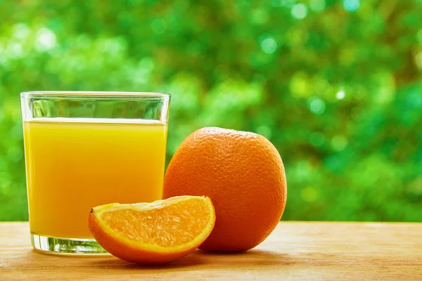 Orange and glass on the table