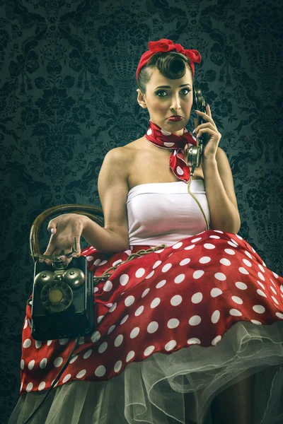 Vintage woman with dial phone