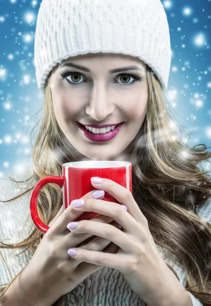 Woman holding a red mug