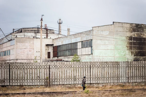 Old factory behind the concrete fence