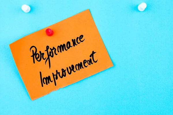 Performance Improvement written on orange paper note