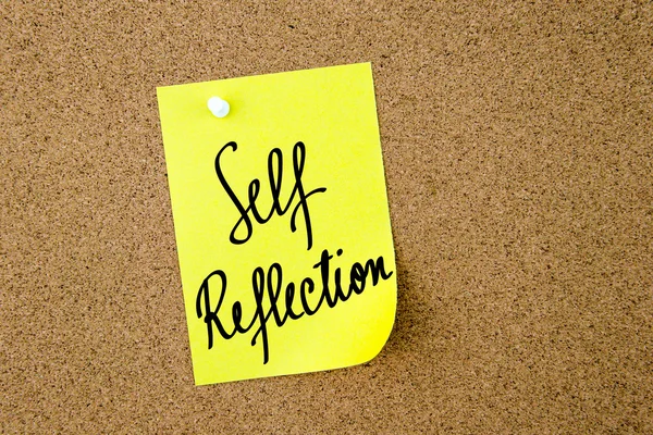 Self Reflection written on yellow paper note