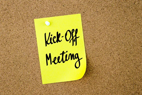 Kick-Off Meeting written on yellow paper note
