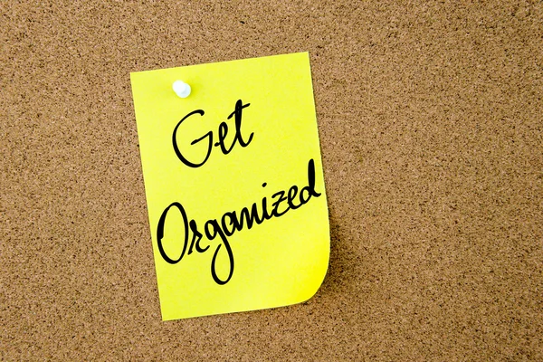 Get Organized written on yellow paper note