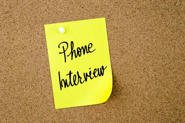 Phone Interview written on yellow paper note