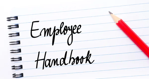 Employee Handbook written on notebook page