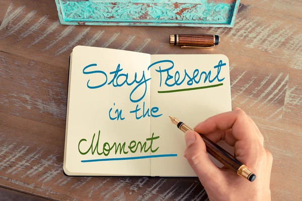 Handwritten text Stay Present in the Moment