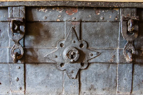 Closeup on the locks of an old metal chest