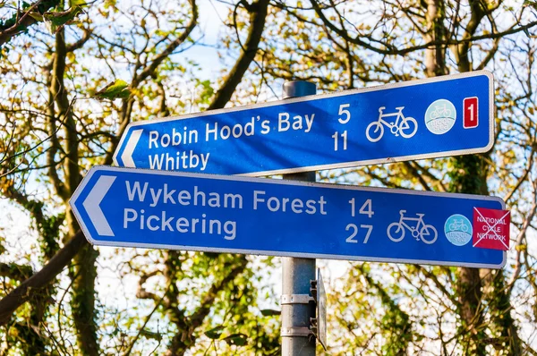 Closeup on tourist Sign posts in village of Ravenscar, UK