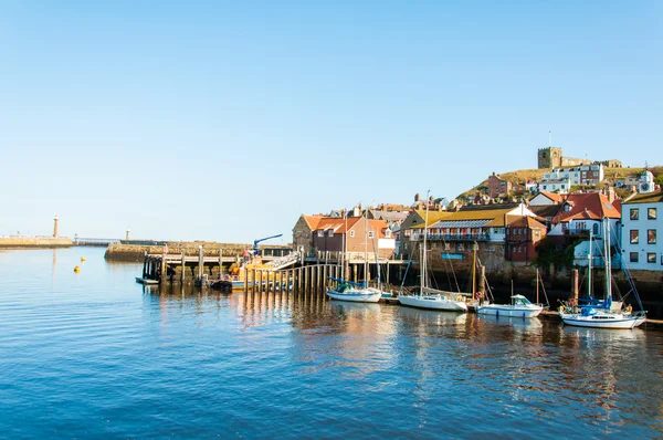 Whitby, North Yorkshire, UK - October 12, 2014:Scenic view of Whitby city and abbey in sunny autumn day, North Yorkshire, UK.