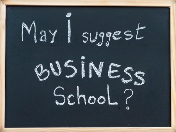May I suggest Business school message written with white chalk on wooden frame blackboard, business learning concept