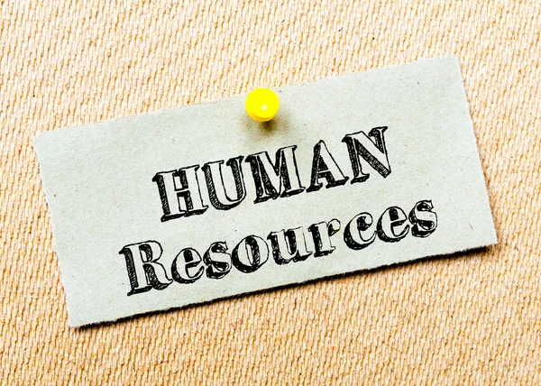 Recycled paper note pinned on cork board. Human Resources message. Concept Image