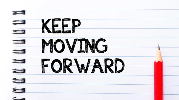 Keep Moving Forward Text written on notebook page