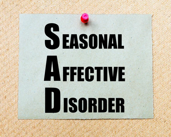 SAD as Seasonal Affective Disorder written on paper note