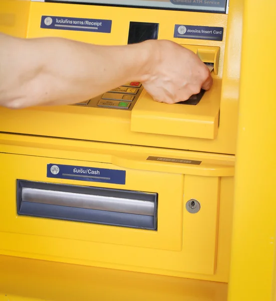 Finger pressing password number on ATM machine