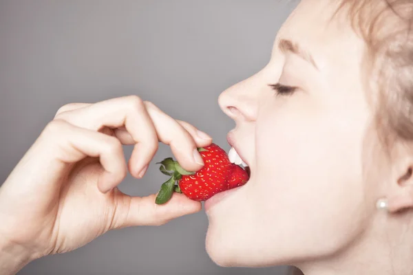 Pretty Girl Biting Strawberry Fruit in a Sexy Way