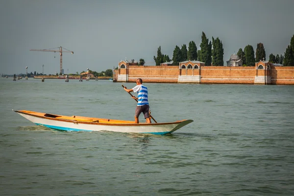 The man on the boat Venice, Italy