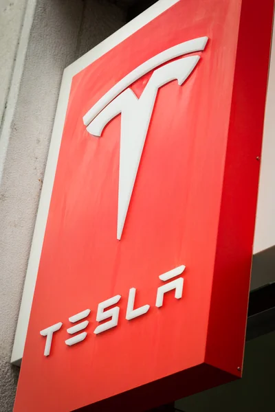 Detail of Tesla logo outside Milan showroom