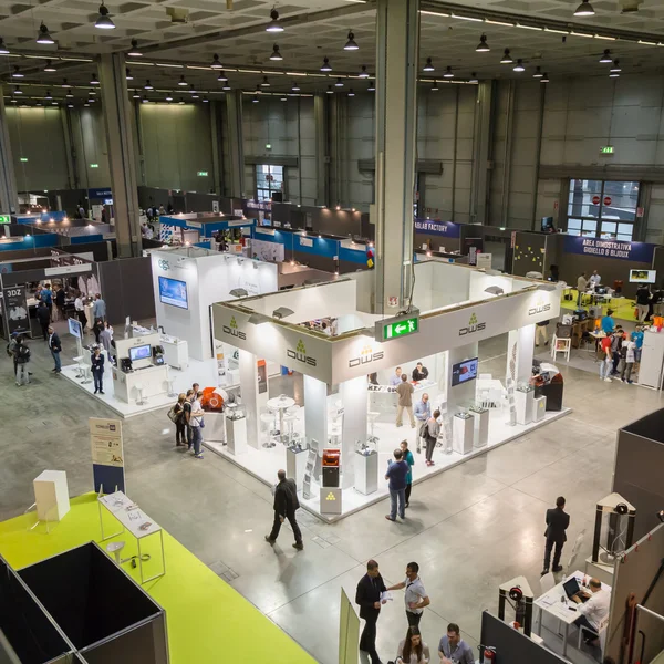 Top view of people and booths at Technology Hub in Milan, Italy