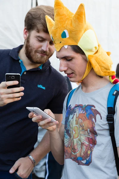 People take part in The Pokemon Go Tour in Milan, Italy