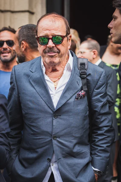 Man outside Gucci fashion shows building for Milan Women's Fashion Week 2014