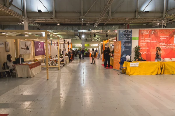 People and stands at Yoga Festival 2014 in Milan, Italy