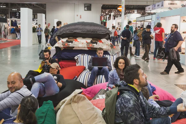 People taking a rest at EICMA 2014 in Milan, Italy