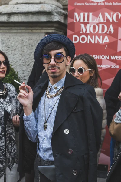 Man outside Jil Sander fashion show building for Milan Women's F