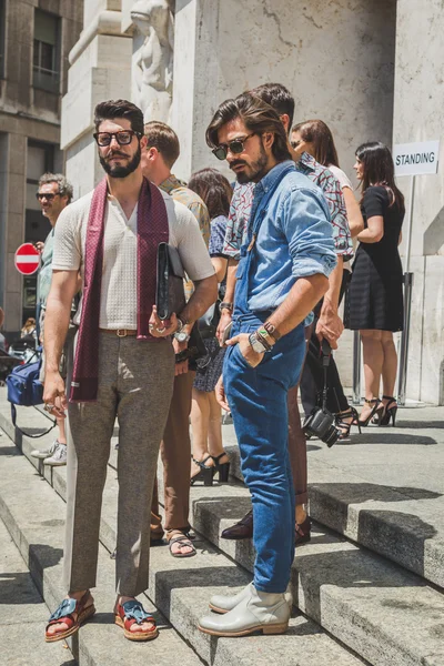 People outside Ferragamo fashion show building for Milan Men\'s F