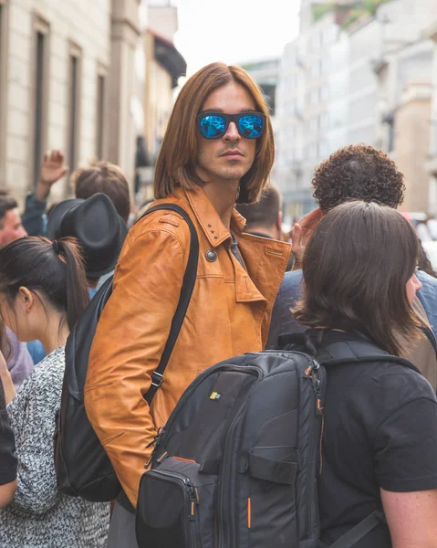 People gather outside Trussardi fashion show building in Milan,