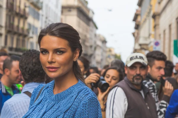 People gather outside Trussardi fashion show building in Milan,