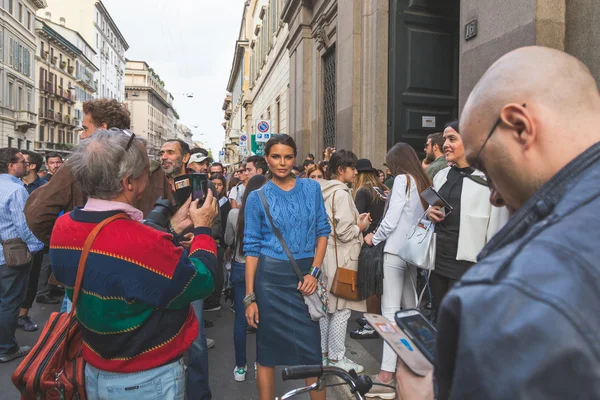 People gather outside Trussardi fashion show building in Milan,
